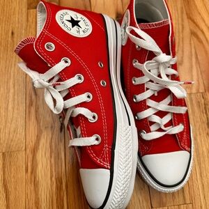 Red Mid Top Converse Chuck Taylor’s. Red lacing is included.